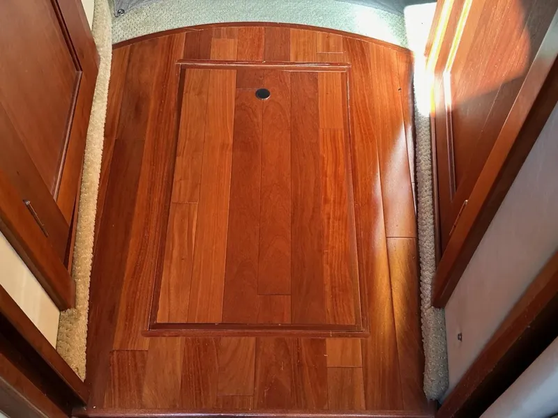 Slide: The Image of Wooden flooring on a 2006 Sea Ray 48 Sundancer yacht interior. - 15