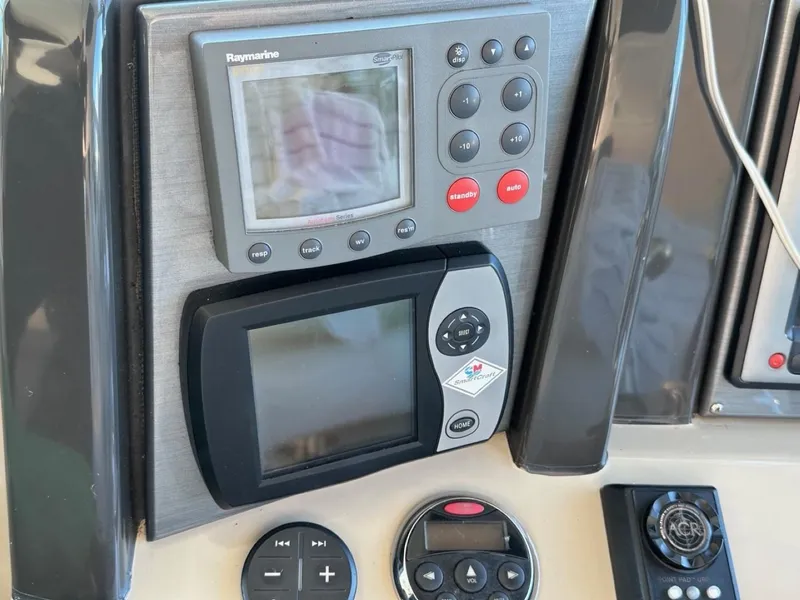 Slide: The Image of Control panel of a 2006 Sea Ray 48 Sundancer with navigation and audio systems. - 5