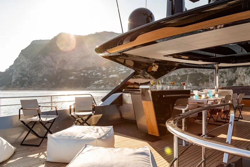 Slide: The Image of Luxurious deck of 2024 Posillipo Technema 90 yacht with scenic mountain view. - 12