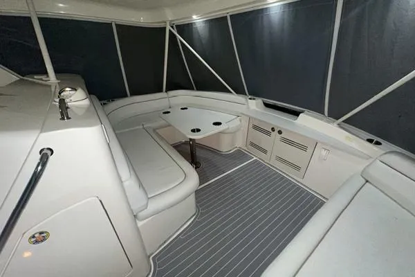 Slide: The Image of 2006 Silverton 50 Convertible yacht helm station with white captain chairs and modern controls. - 10