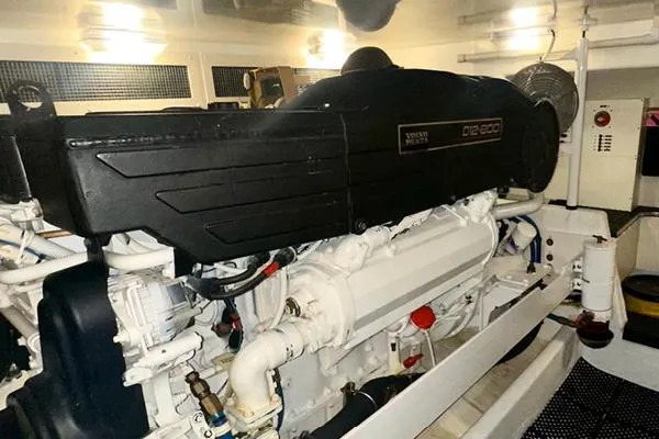 Slide: The Image of Engine room of a 2006 Silverton 50 Convertible yacht, showcasing machinery and equipment. - 19