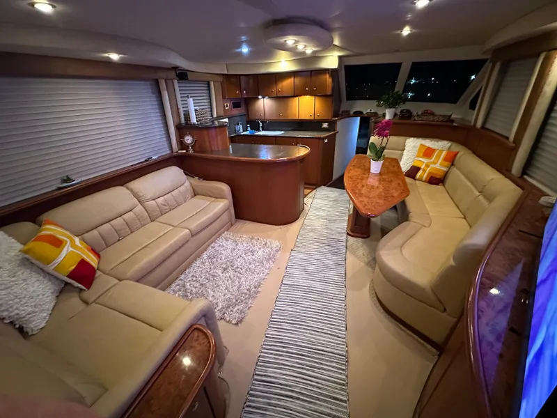 Slide: The Image of Luxurious interior of a 2006 Silverton 50 Convertible yacht with elegant seating and modern amenities. - 22