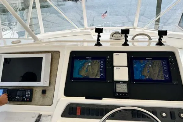 Slide: The Image of 2006 Silverton 50 Convertible yacht helm with advanced navigation systems and controls. - 6