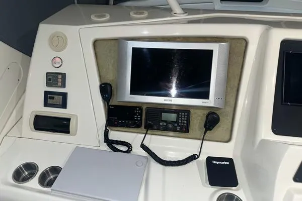 Slide: The Image of 2006 Silverton 50 Convertible boat dashboard with navigation screens and controls. - 7