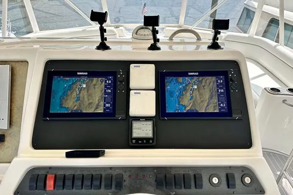 Slide: The Image of Control panel of a 2006 Silverton 50 Convertible yacht with navigation equipment. - 8