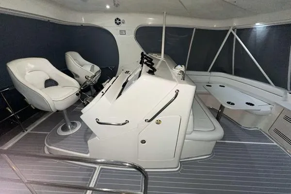 Slide: The Image of 2006 Silverton 50 Convertible yacht helm with dual Simrad navigation displays. - 9