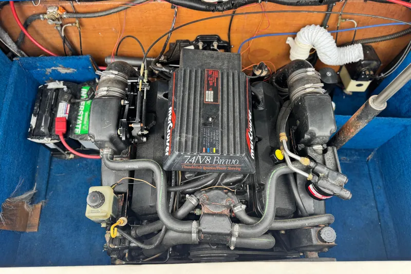 Slide: The Image of 1994 Howard 22 Bowrider engine compartment with MerCruiser 7.4L V8 Bravo engine. - 19
