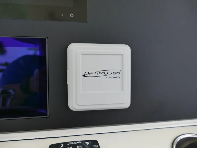 Slide: The Image of Optimus EPS control panel on 2024 Pioneer 270 Pelagic boat dashboard. - 13