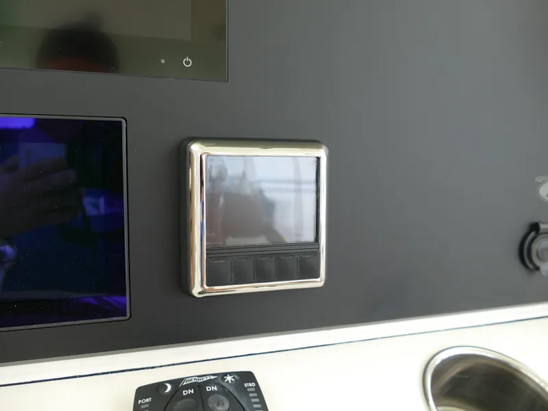 Slide: The Image of Control panel of 2024 Pioneer 270 Pelagic boat with touchscreen and buttons. - 14