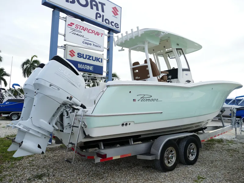 Slide: The Image of 2024 Pioneer 270 Pelagic boat on trailer at dealership. - 2