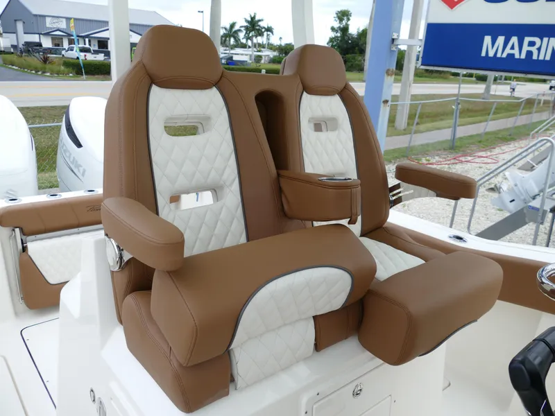 Slide: The Image of 2024 Pioneer 270 Pelagic boat with luxurious brown and white leather seats. - 26