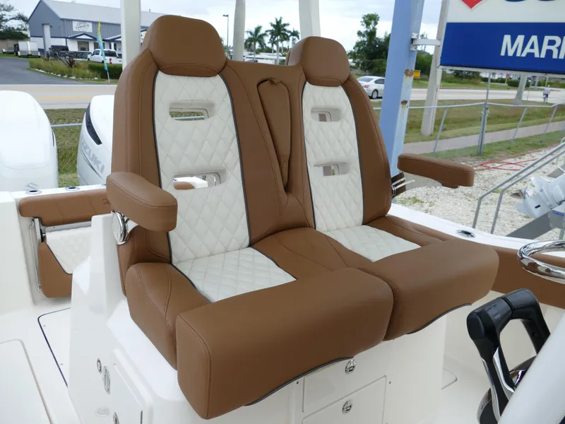 Slide: The Image of 2024 Pioneer 270 Pelagic boat with luxurious brown and white seating. - 27