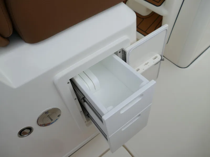 Slide: The Image of Open storage compartment on 2024 Pioneer 270 Pelagic boat. - 33