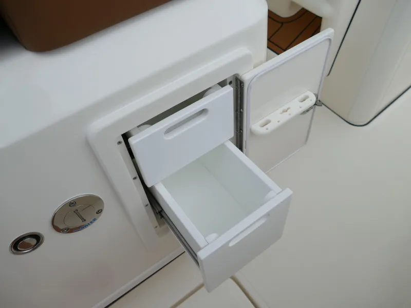 Slide: The Image of 2024 Pioneer 270 Pelagic boat storage compartment with open drawer - 34
