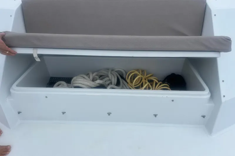 Slide: The Image of Storage compartment on 1999 Hatteras 74 Sport Deck Motor Yacht with ropes and equipment. - 165