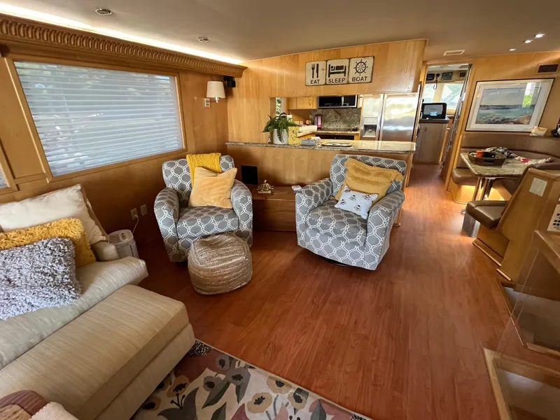 Slide: The Image of Luxurious interior of 1999 Hatteras 74 Sport Deck Motor Yacht with cozy seating and modern decor. - 26