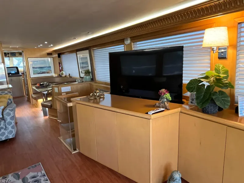 Slide: The Image of Luxurious interior of 1999 Hatteras 74 Sport Deck Motor Yacht with modern furnishings. - 28