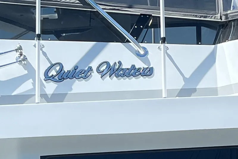 Slide: The Image of 1999 Hatteras 74 Sport Deck Motor Yacht with "Quiet Waters" nameplate. - 3