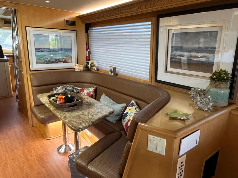 Slide: The Image of Luxurious interior of 1999 Hatteras 74 Sport Deck Motor Yacht with elegant seating and decor. - 36