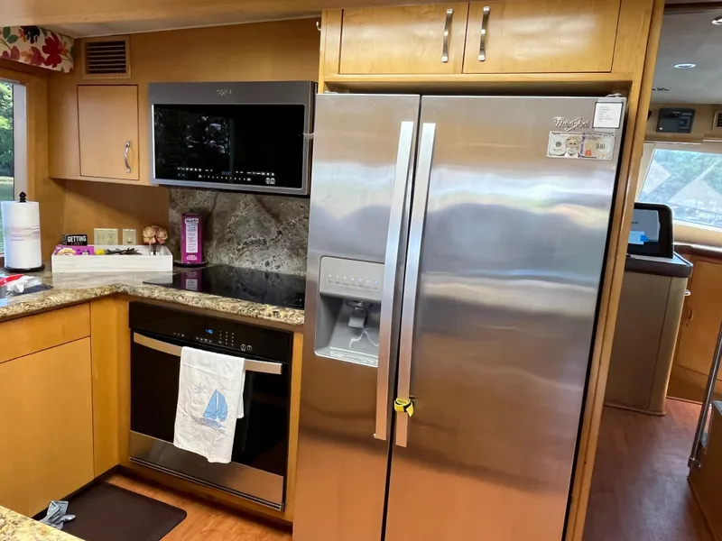 Slide: The Image of Modern kitchen in 1999 Hatteras 74 Sport Deck Motor Yacht with stainless steel appliances. - 37