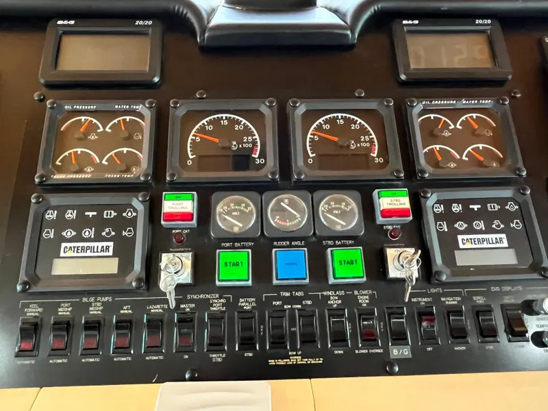 Slide: The Image of Control panel of a 1999 Hatteras 74 Sport Deck Motor Yacht with gauges and switches. - 46