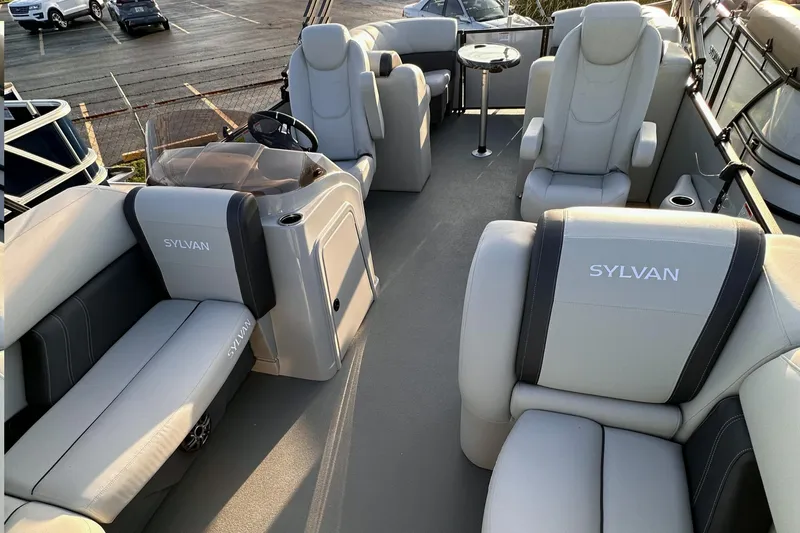 Slide: The Image of 2023 Sylvan Mirage X X3 boat interior with luxurious seating and helm station. - 3