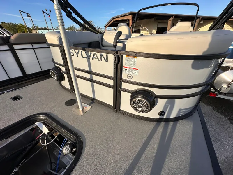 Slide: The Image of 2023 Sylvan Mirage X X3 pontoon boat interior with seating and speakers. - 5