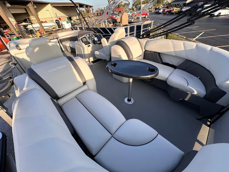 Slide: The Image of 2023 Sylvan Mirage X X3 pontoon boat with spacious seating and table. - 6