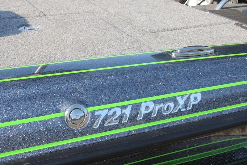 Slide: The Image of 2024 Phoenix 721 Pro XP boat with green accents. - 11