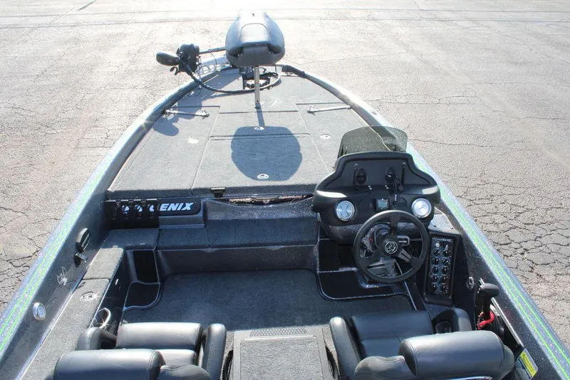 Slide: The Image of 2024 Phoenix 721 Pro XP boat interior with steering console and seating. - 14