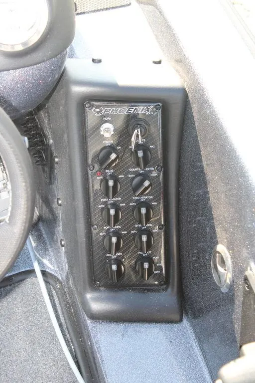Slide: The Image of Control panel of a 2024 Phoenix 721 Pro XP boat. - 17