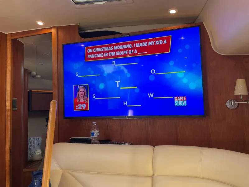 Slide: The Image of 2008 Tiara Yachts 4300 Sovran interior with game show on TV. - 23