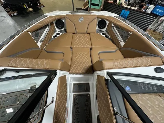 Slide: The Image of 2024 Tigé 22RZX boat interior with tan diamond-stitched seating and modern design. - 14