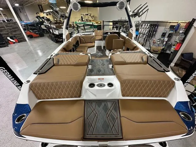 Slide: The Image of 2024 Tigé 22RZX boat interior with tan leather seating and modern design. - 6