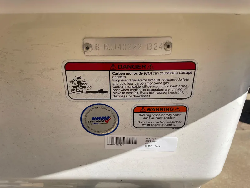Slide: The Image of 2024 Mako Pro Skiff 13 CC warning labels and serial number plate. - 6