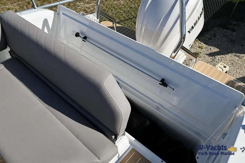 Slide: The Image of Yamarin 80 boat 2024 model with open storage compartment and grey seating. - 11