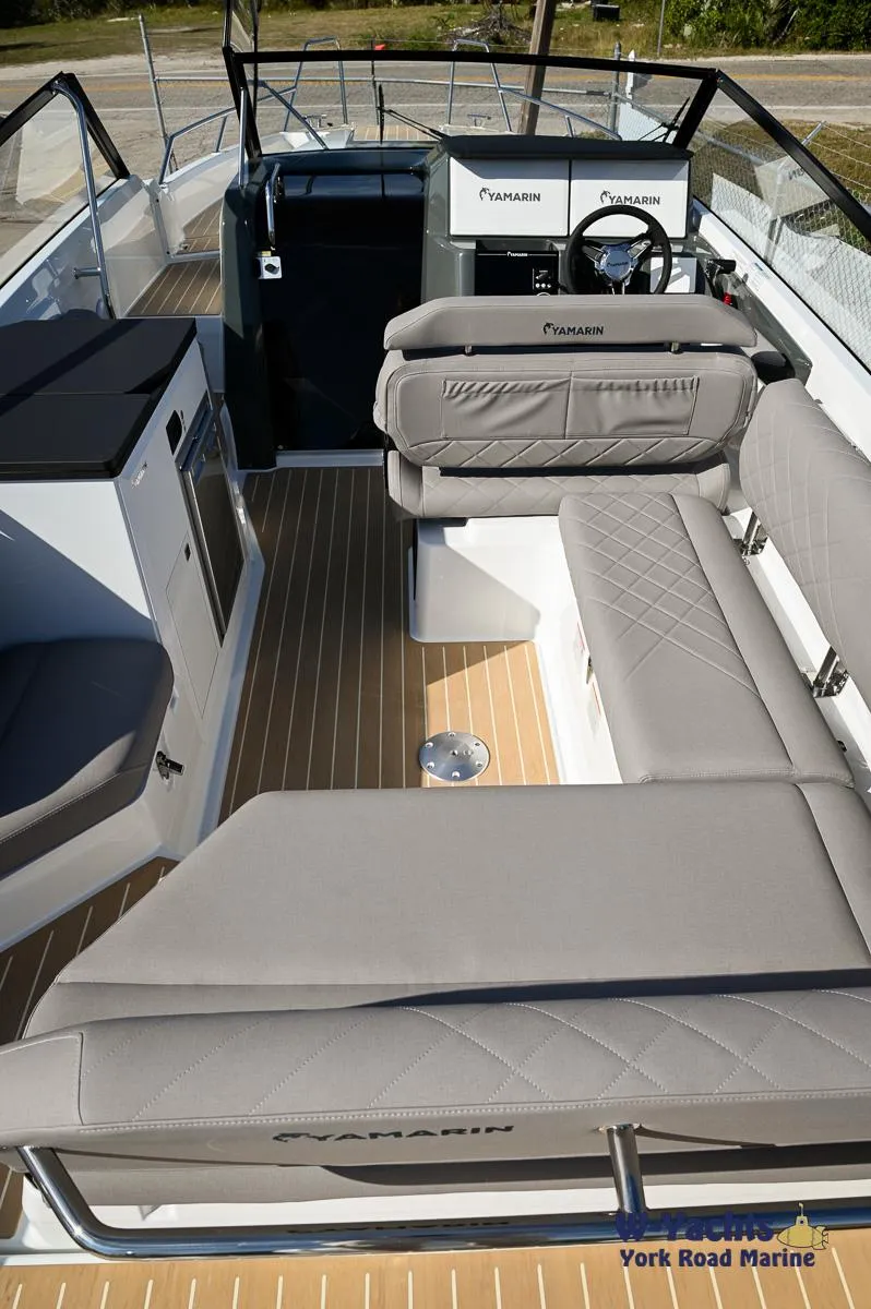Slide: The Image of 2024 Yamarin 80 boat interior with modern seating and steering console. - 16