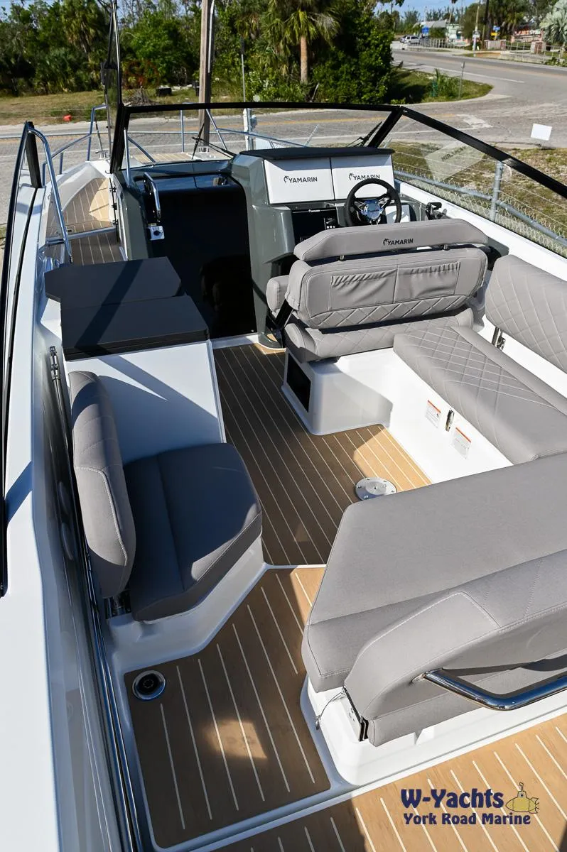 Slide: The Image of 2024 Yamarin 80 boat interior with modern seating and steering console. - 17