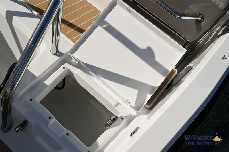 Slide: The Image of Yamarin 80 boat 2024 model, open storage compartment, white deck, stainless steel railing. - 22