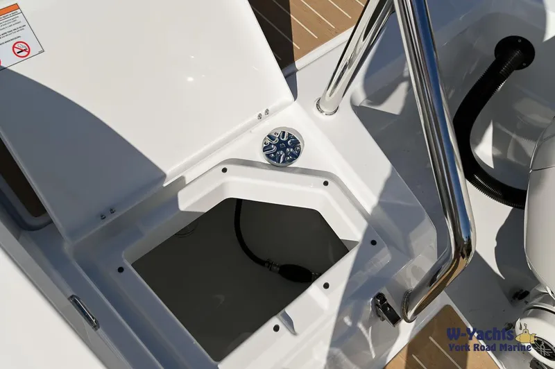 Slide: The Image of Yamarin 80 boat storage compartment, 2024 model, with stainless steel railing and wooden deck. - 29