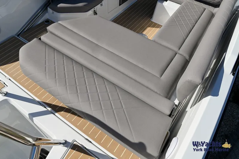 Slide: The Image of 2024 Yamarin 80 boat with luxurious gray seating and teak deck. - 32
