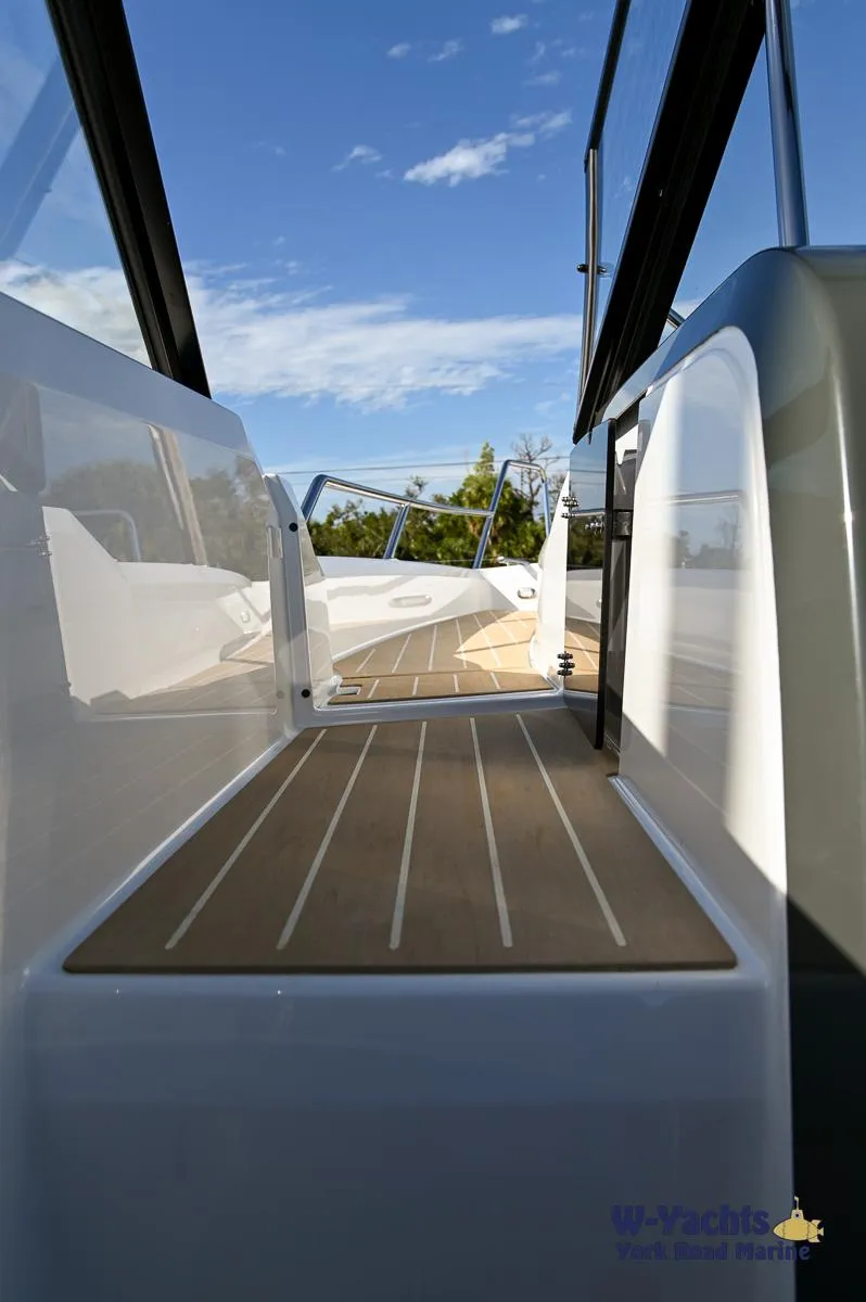 Slide: The Image of 2024 Yamarin 80 boat deck with sleek design and wooden flooring. - 36