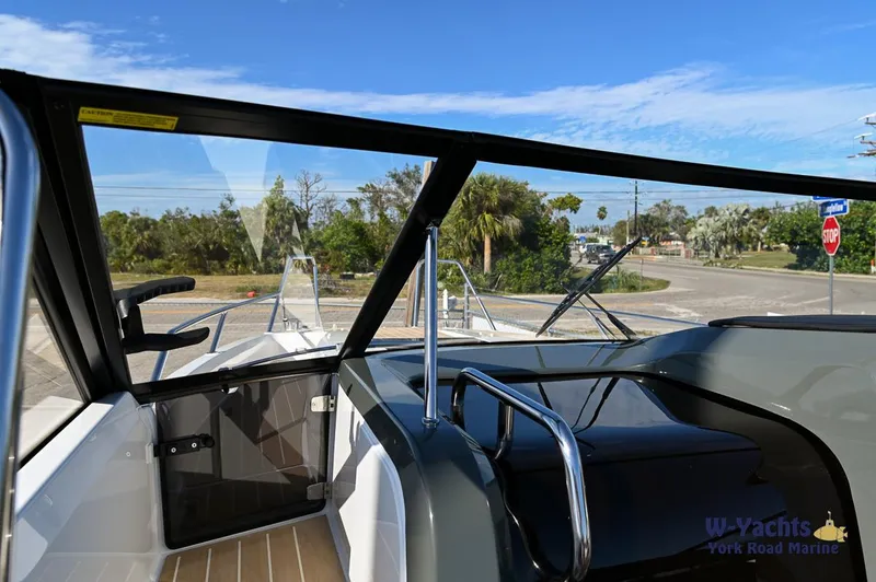 Slide: The Image of 2024 Yamarin 80 boat interior with windshield and steering console. - 37