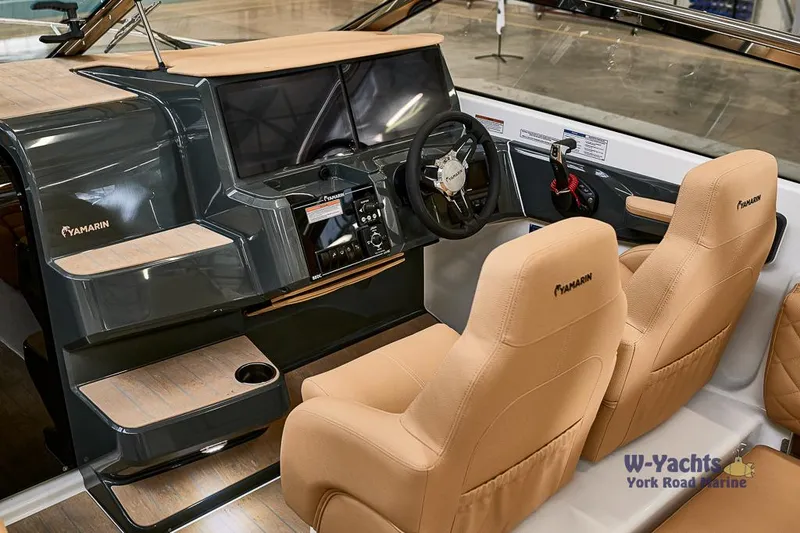 Slide: The Image of Yamarin 88 2023 boat interior with beige seats and modern dashboard. - 10