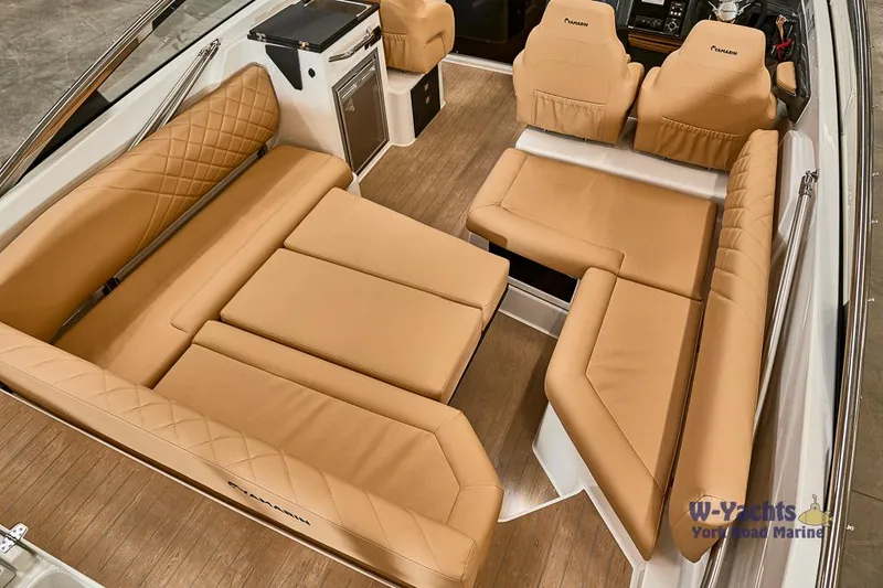 Slide: The Image of Luxurious interior of 2023 Yamarin 88 boat with tan leather seating and wood flooring. - 14