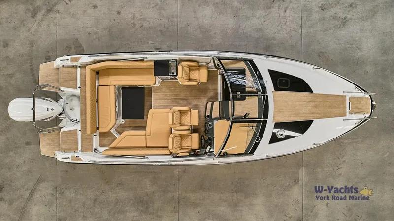 Slide: The Image of Top view of 2023 Yamarin 88 boat with tan seating and wooden deck. - 18