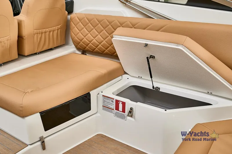 Slide: The Image of Yamarin 88 boat interior, 2023 model, featuring tan leather seats and storage compartment. - 19