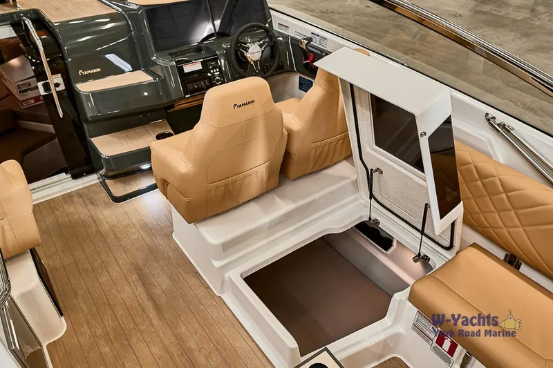 Slide: The Image of Interior of 2023 Yamarin 88 boat with tan leather seats and wooden flooring. - 20
