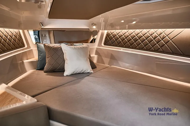 Slide: The Image of Luxurious interior cabin of 2023 Yamarin 88 boat with plush bedding and cushions. - 5