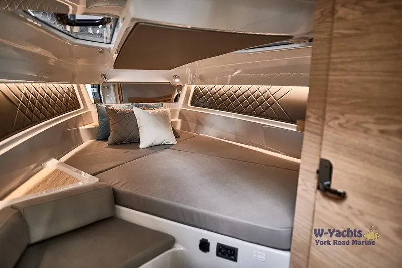 Slide: The Image of 2023 Yamarin 88 boat cabin with modern interior and comfortable bedding. - 6
